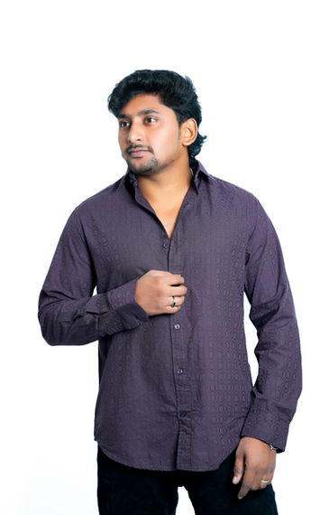 Man wearing a purple button-down shirt. Looking to the side. lunexwear