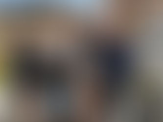 A photograph of Principal Adam Kushner and a few of his interns (past and present) standing at his 16 Minetta Lane home.