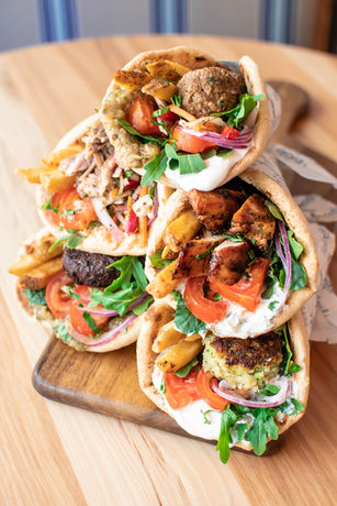 Pile of Pita Sandwiches filled with delicious, colorful meats and vegetables