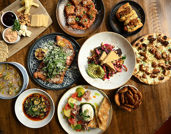 Variety of small plates and dishes on a wooden table