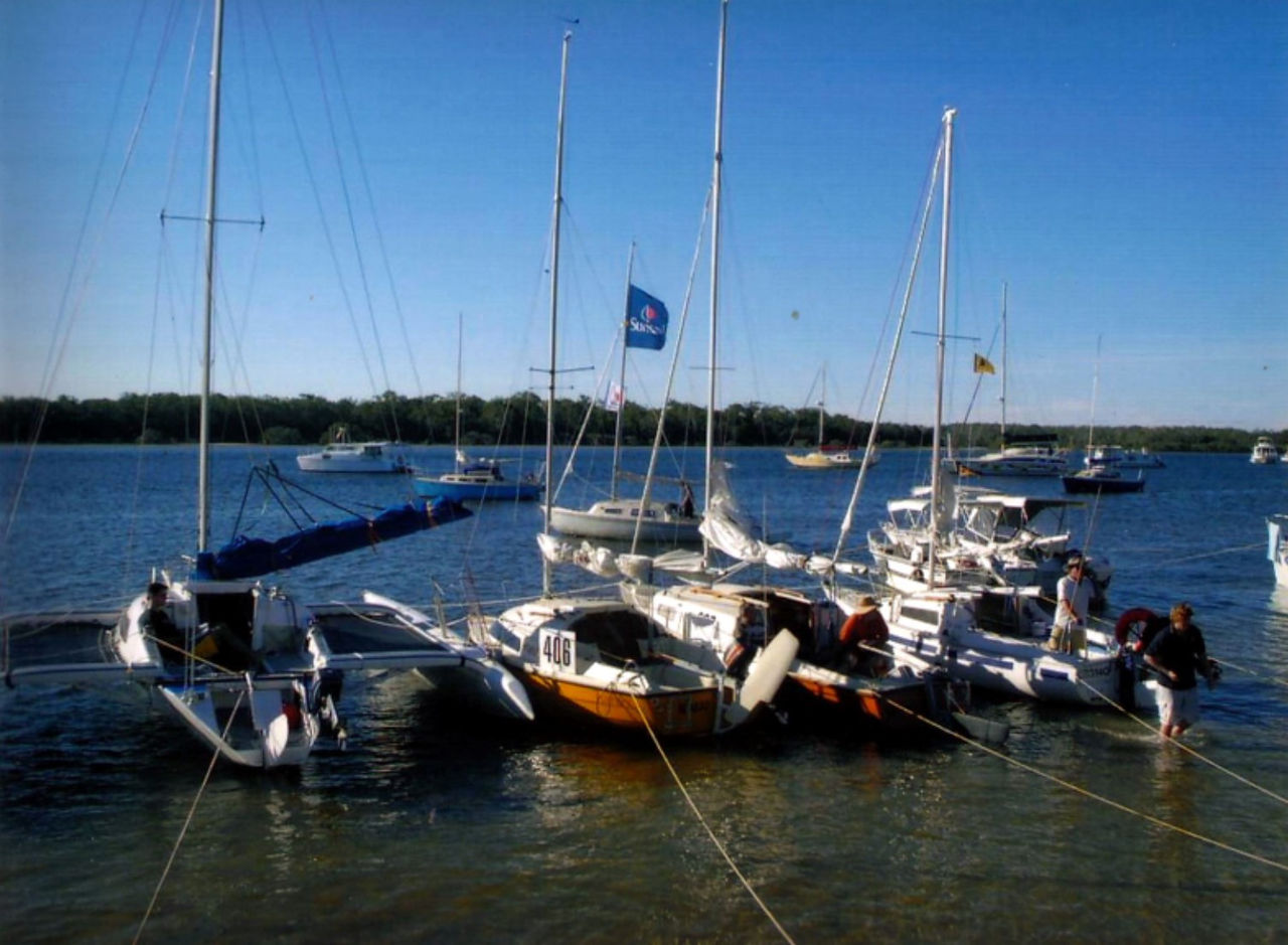 Boats anchored and rafted up in front of the yacht club