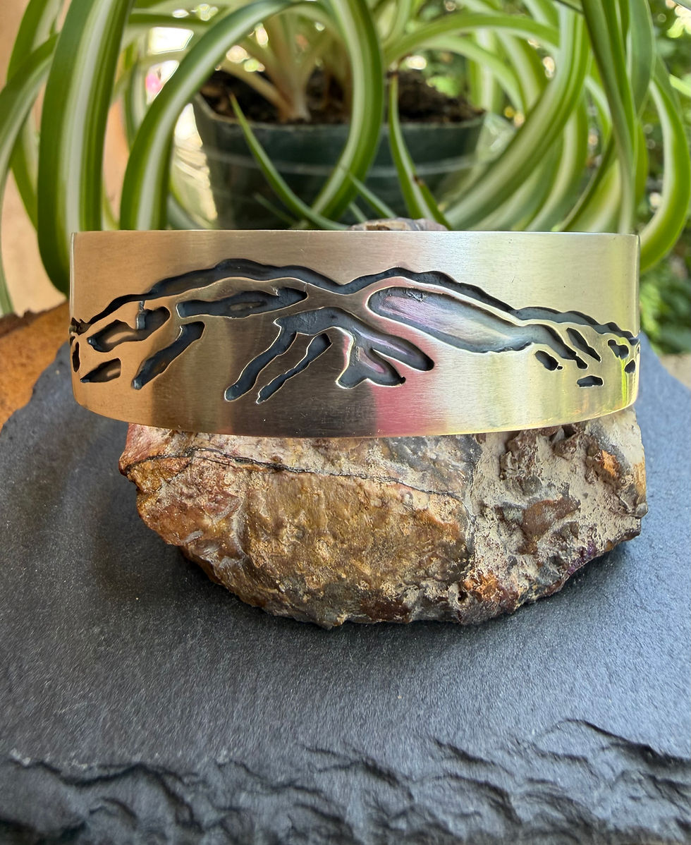 Taos Mountain Cuff — pierced sterling silver mountain silhouette, oxidized detail, handcrafted Taos, New Mexico