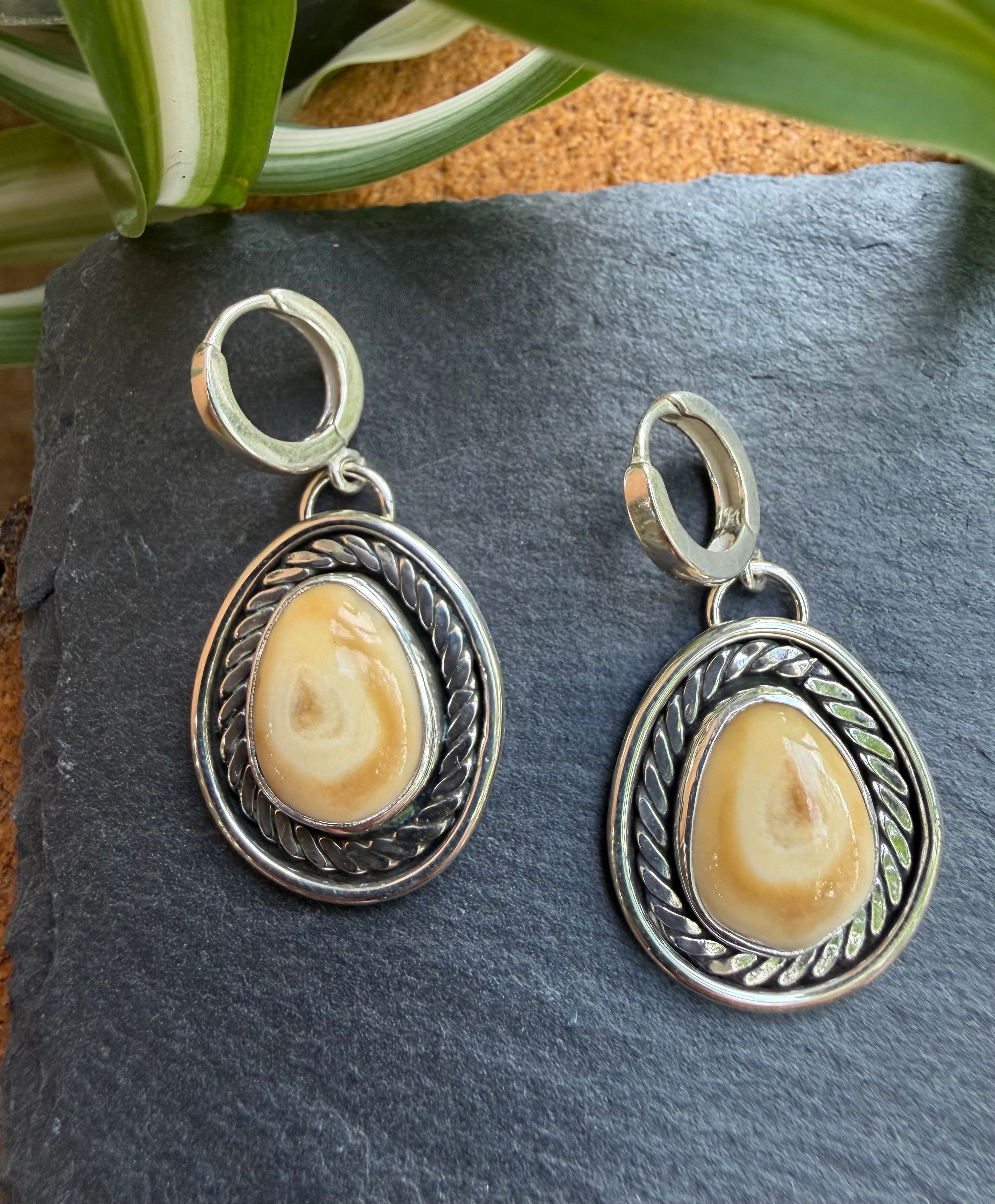 Elk ivory oval earrings in double rope-twist halo, handcrafted Taos, New Mexico