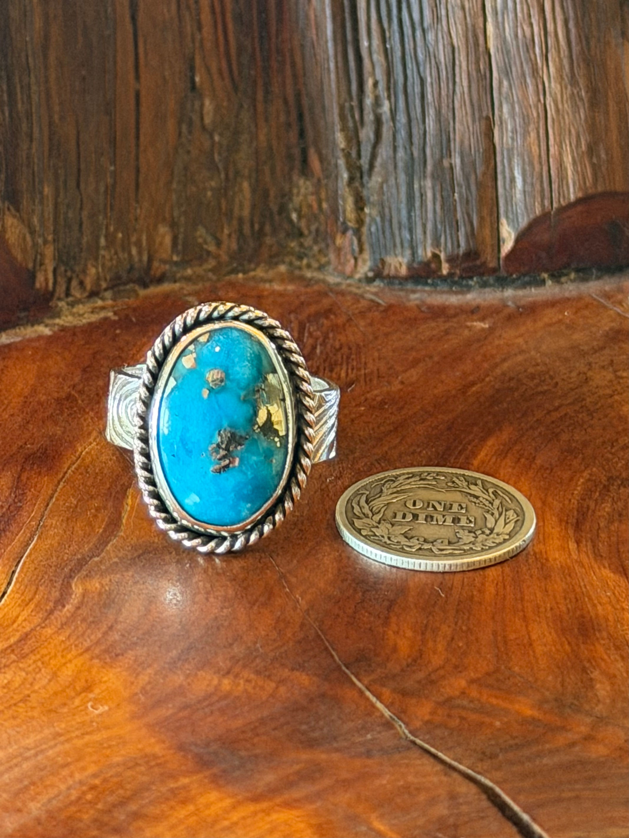 Morenci II turquoise oval ring, vivid sky blue dark matrix, twisted rope border, oxidized finish, Taos, New Mexico