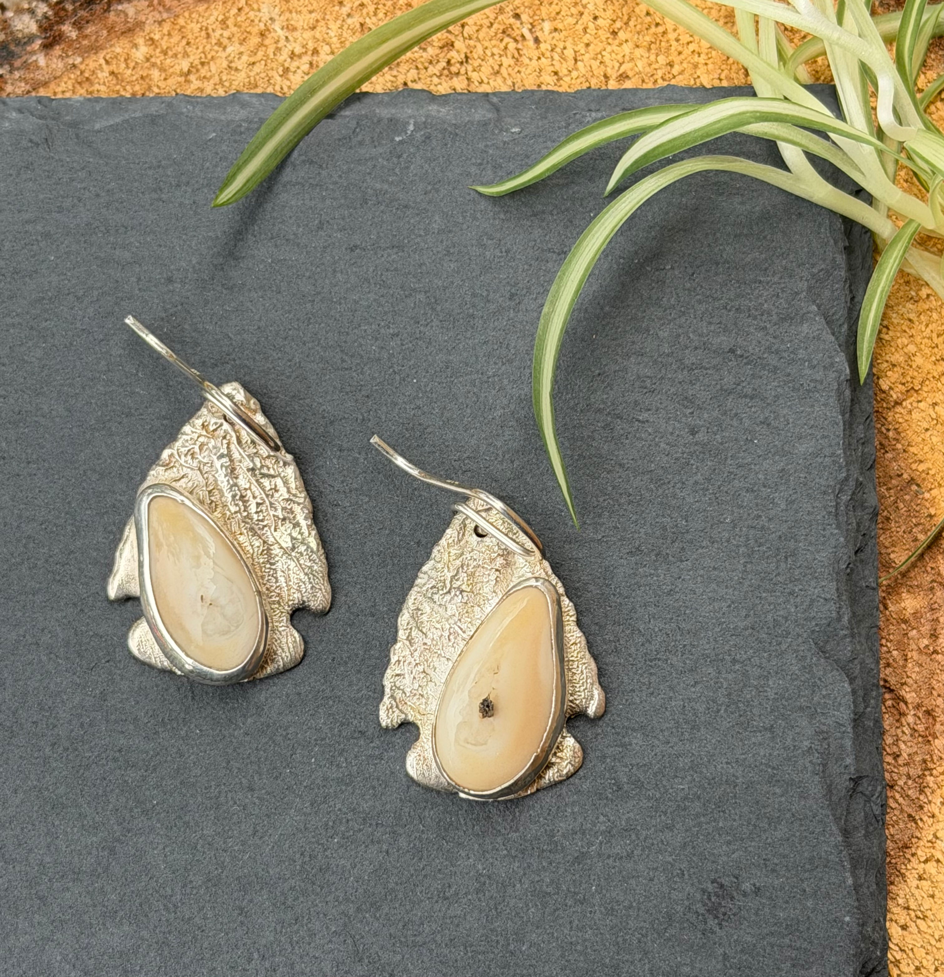 Elk ivory arrowhead earrings with reticulated silver texture, handcrafted in Taos, New Mexico