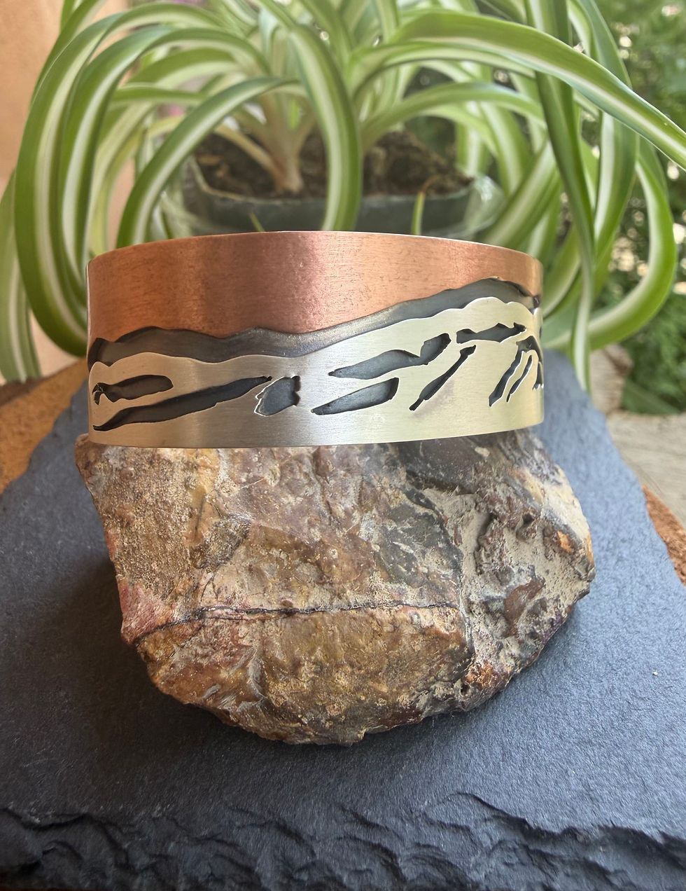 Zia symbol stamp detail on brushed sterling silver, Southwest artisan jewelry