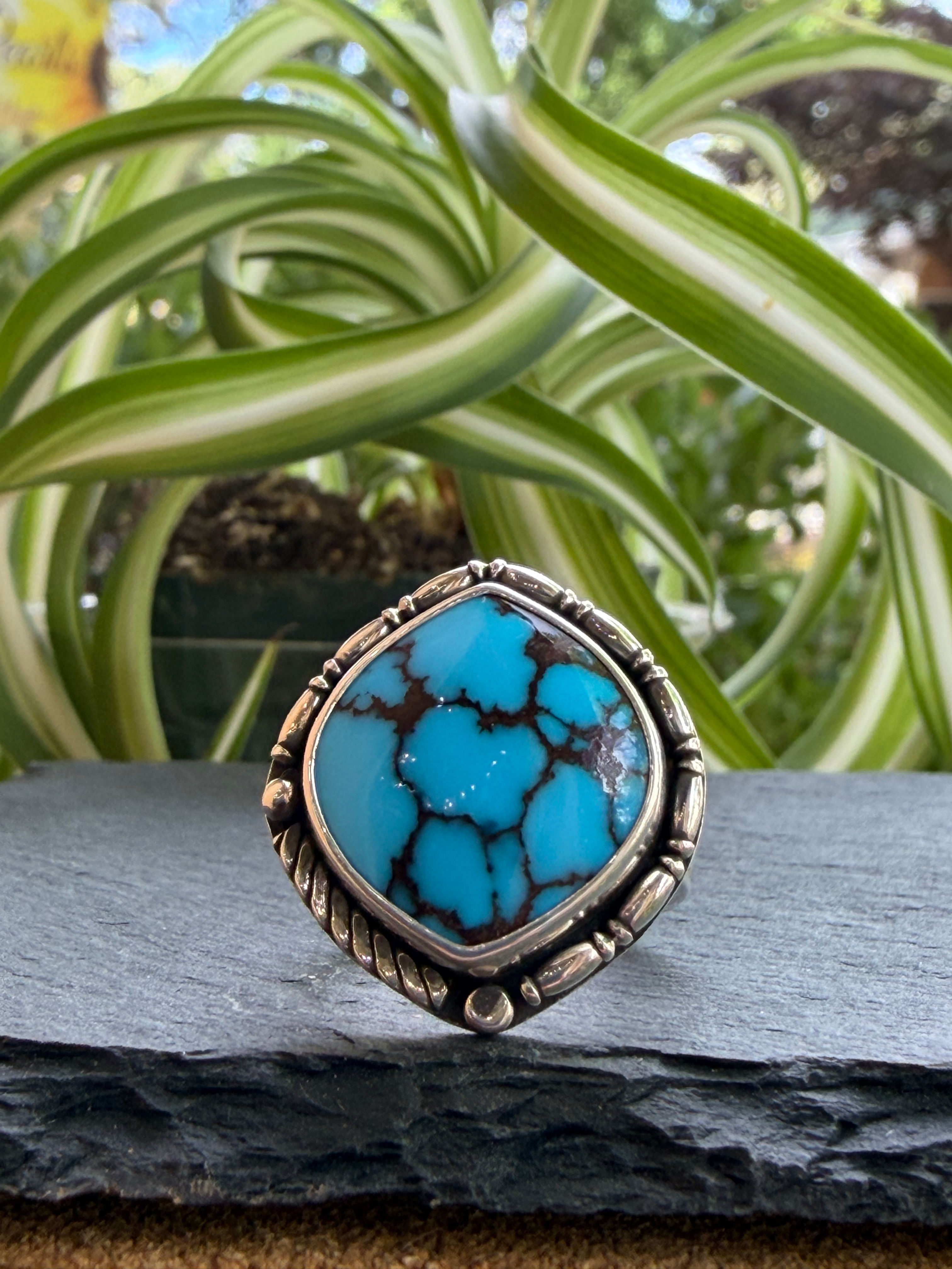 Egyptian turquoise ring with sky blue color and dark matrix in hand-stamped sterling silver, handcrafted Taos, New Mexico