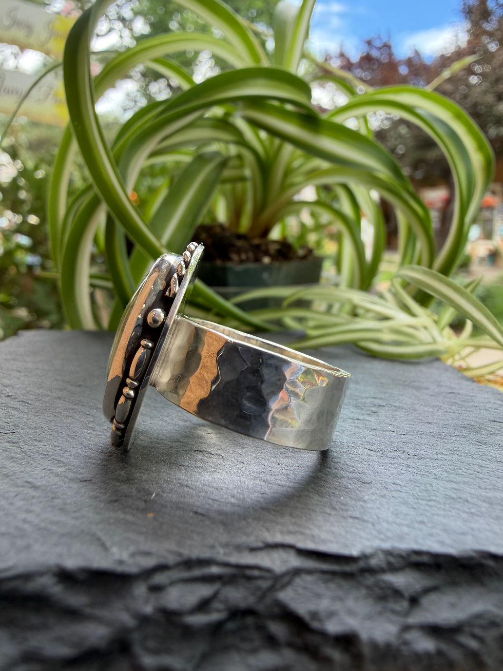 Hammered sterling silver band beneath sage and caramel variscite, Southwest artisan jewelry