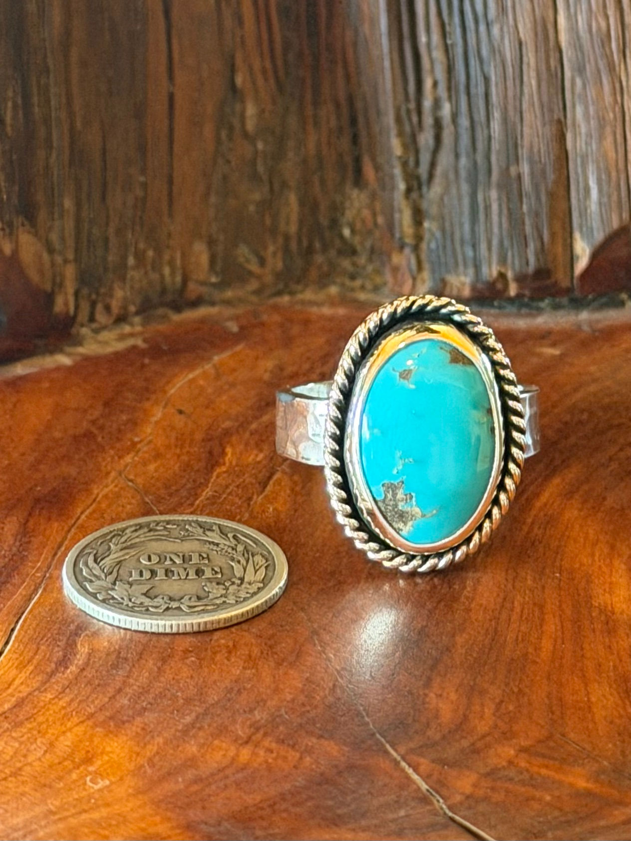 Morenci II turquoise oval ring, vivid sky blue warm brown matrix, twisted rope border, oxidized finish, Taos, New Mexico