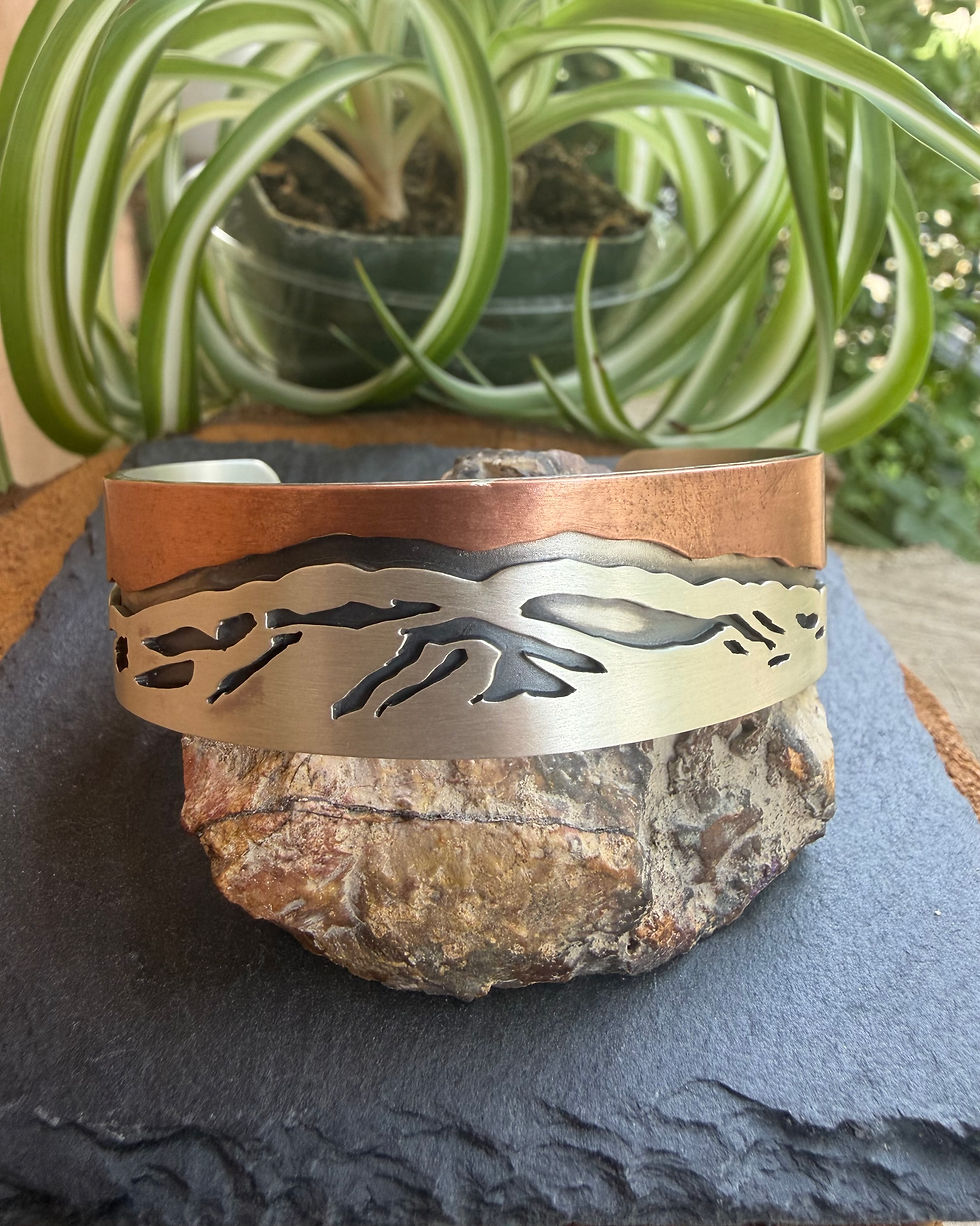 Hand-stamped Zia sun symbol on sterling silver cuff interior, handcrafted in Taos, New Mexico
