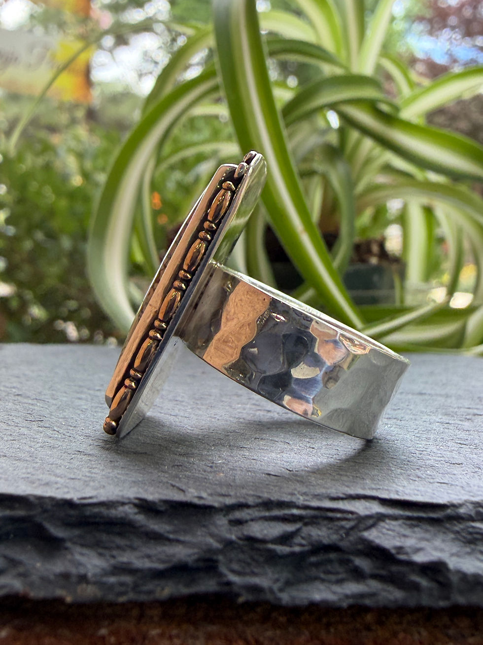 Hammered sterling silver band beneath ivory variscite matrix, Southwest artisan jewelry