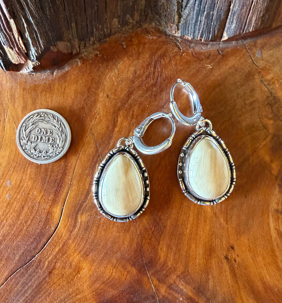 Wooly mammoth tusk teardrop earrings with beaded silver bezel, handcrafted in Taos, New Mexico