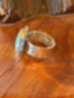 Hammered sterling silver band beneath Kingman turquoise stone, Southwest artisan jewelry
