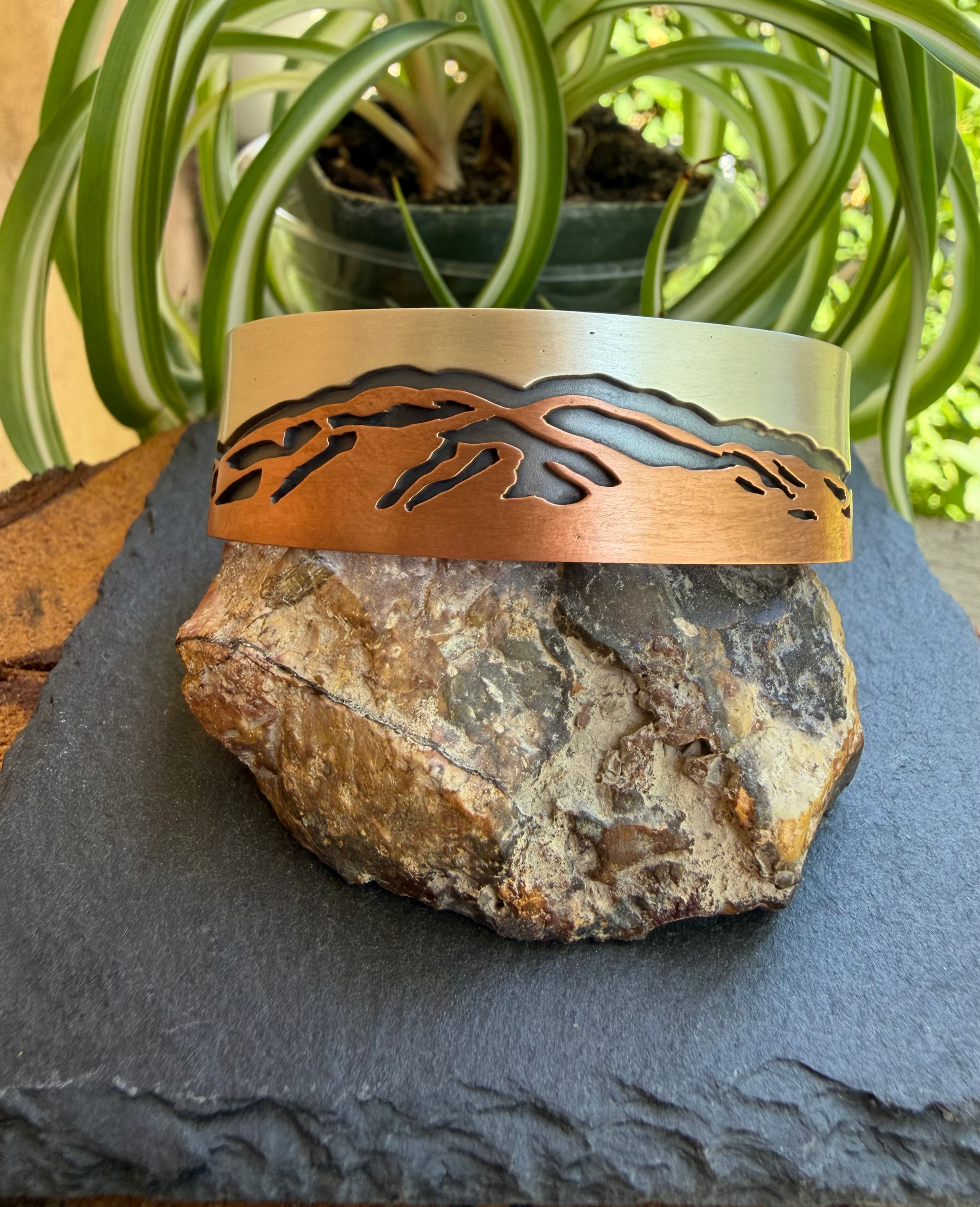 Hand-stamped Zia sun symbol on copper cuff interior, handcrafted in Taos, New Mexico