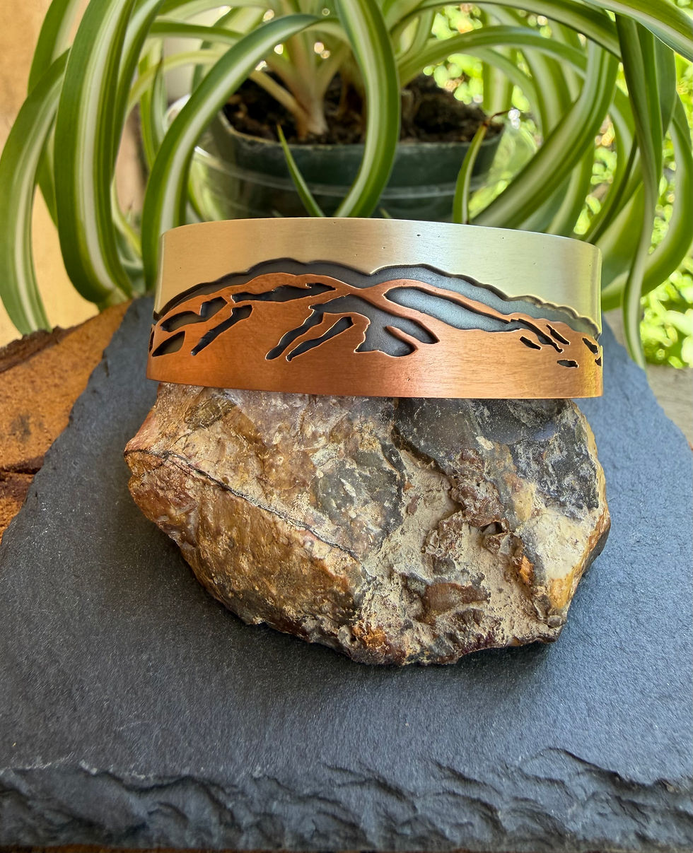 Hand-stamped Zia sun symbol on copper cuff interior, handcrafted in Taos, New Mexico