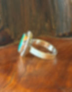 Iced sterling silver band beneath green turquoise stone, Southwest artisan jewelry