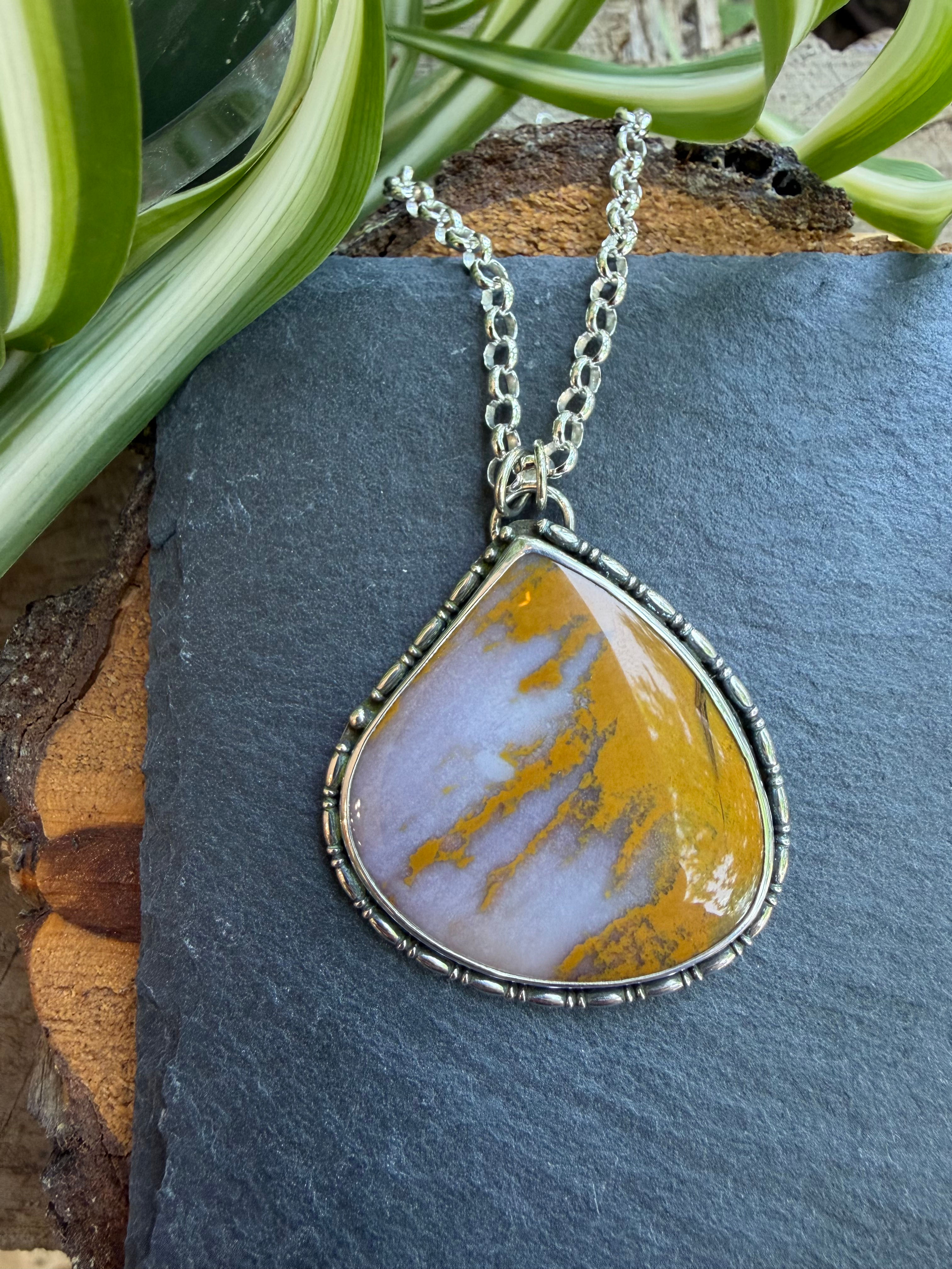Sunset agate shield pendant with ochre streaking, handcrafted Taos, New Mexico