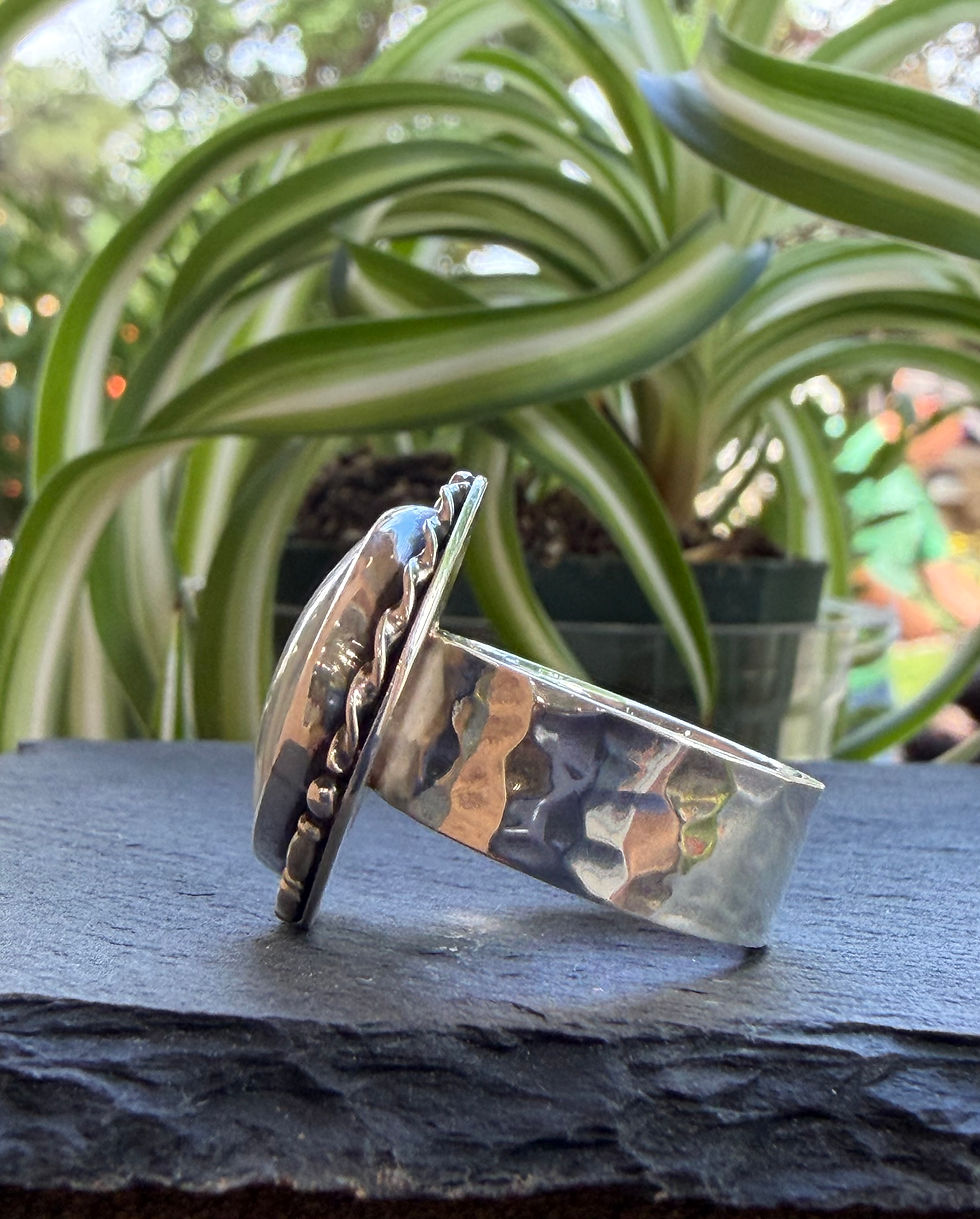Hammered sterling silver band beneath pale variscite stone, Southwest artisan jewelry