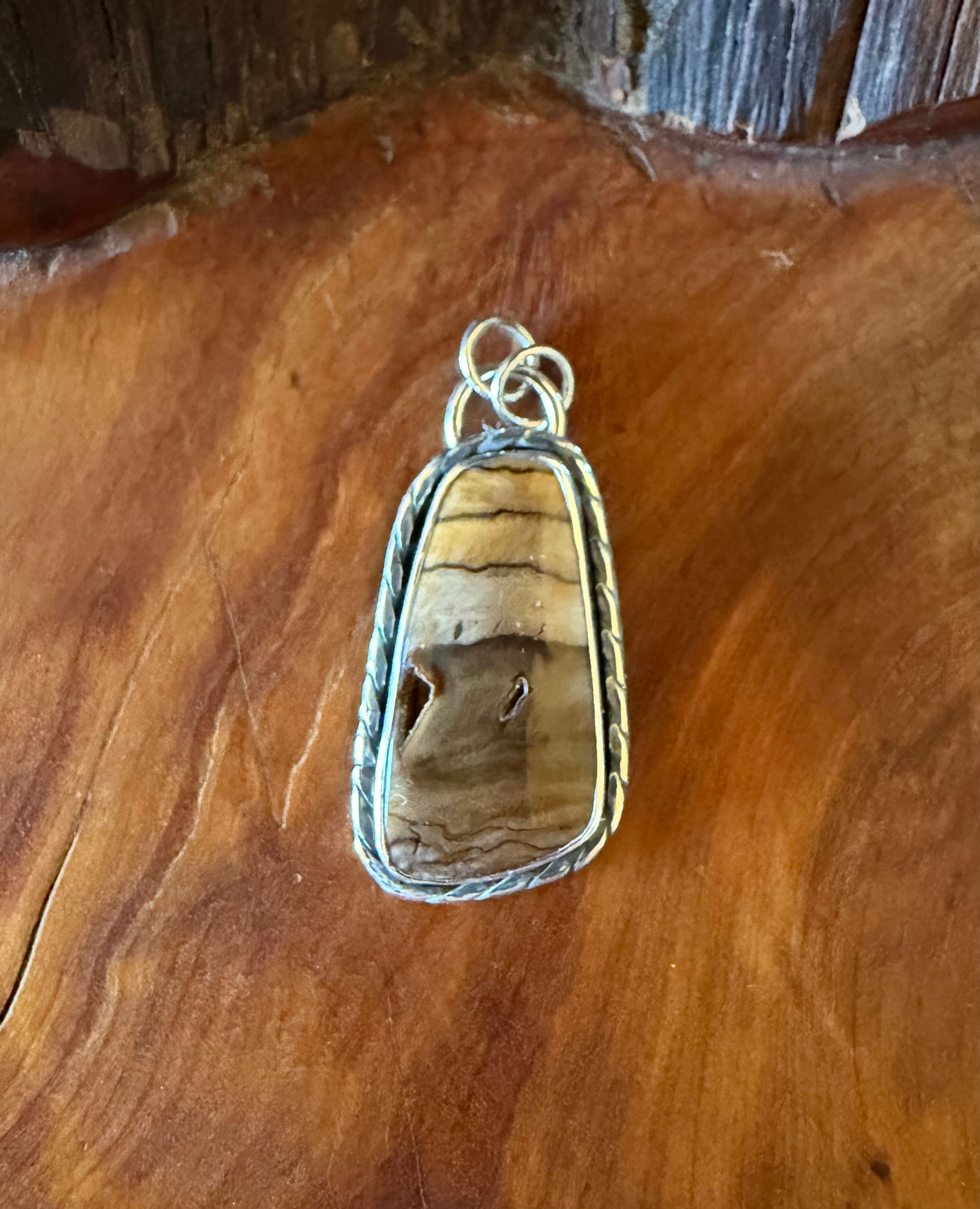 Washington Badger Pocket jasper pendant, warm banded stone, natural void inclusion, Fire & Stone Jewelry Studio Taos