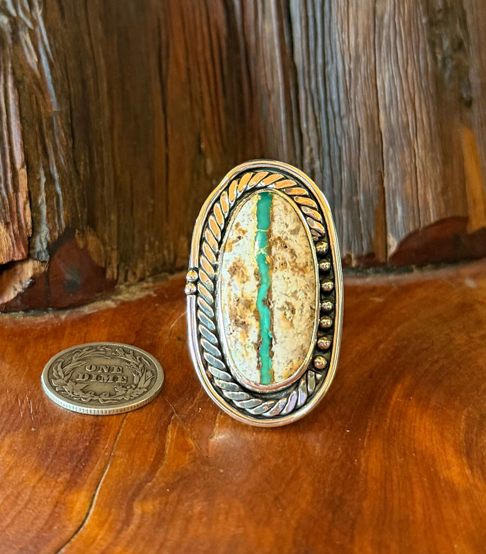 Stone Mountain ribbon turquoise ring, vivid teal vein through cream ochre host rock, double rope border, Taos, New Mexico