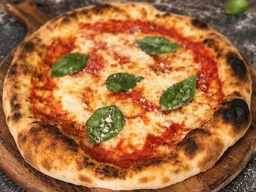A classic Neapolitan Margherita pizza, made with a light, airy dough, rich tomato sauce, creamy mozzarella and fresh basil. Master this classic on your carbon baking steel for a beautifully blistered crust and authentic pizzeria-style finish.