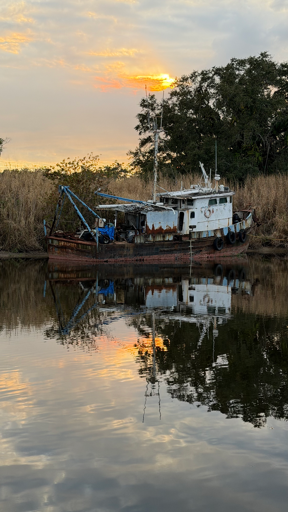 A Derelict Tug Captured by a Sundog