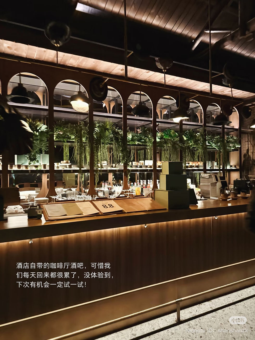 Hotel indoor bar with menu & wine selection.