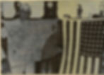 Avery Cox displays a portion of the Japanese flag, and the American flag he Guarded in captivity