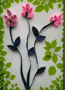 Paper quilling flowers: pink and blue blossoms