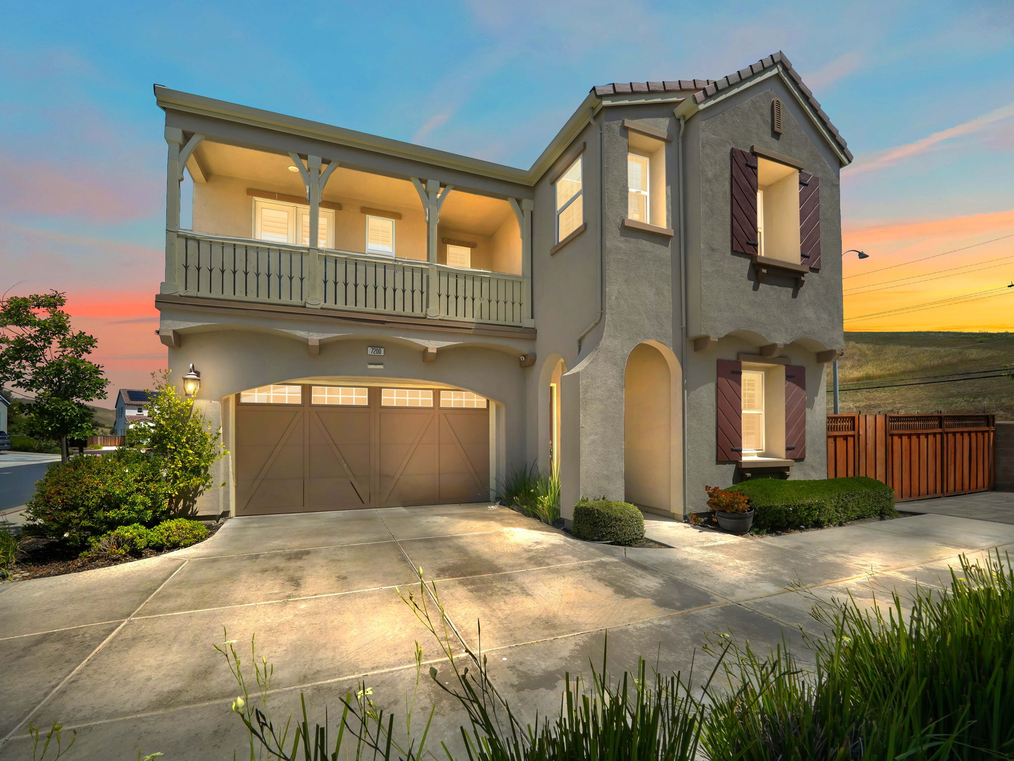 The stunning exterior of 7200 Kylemore Court featuring modern architectural details and professional landscaping.