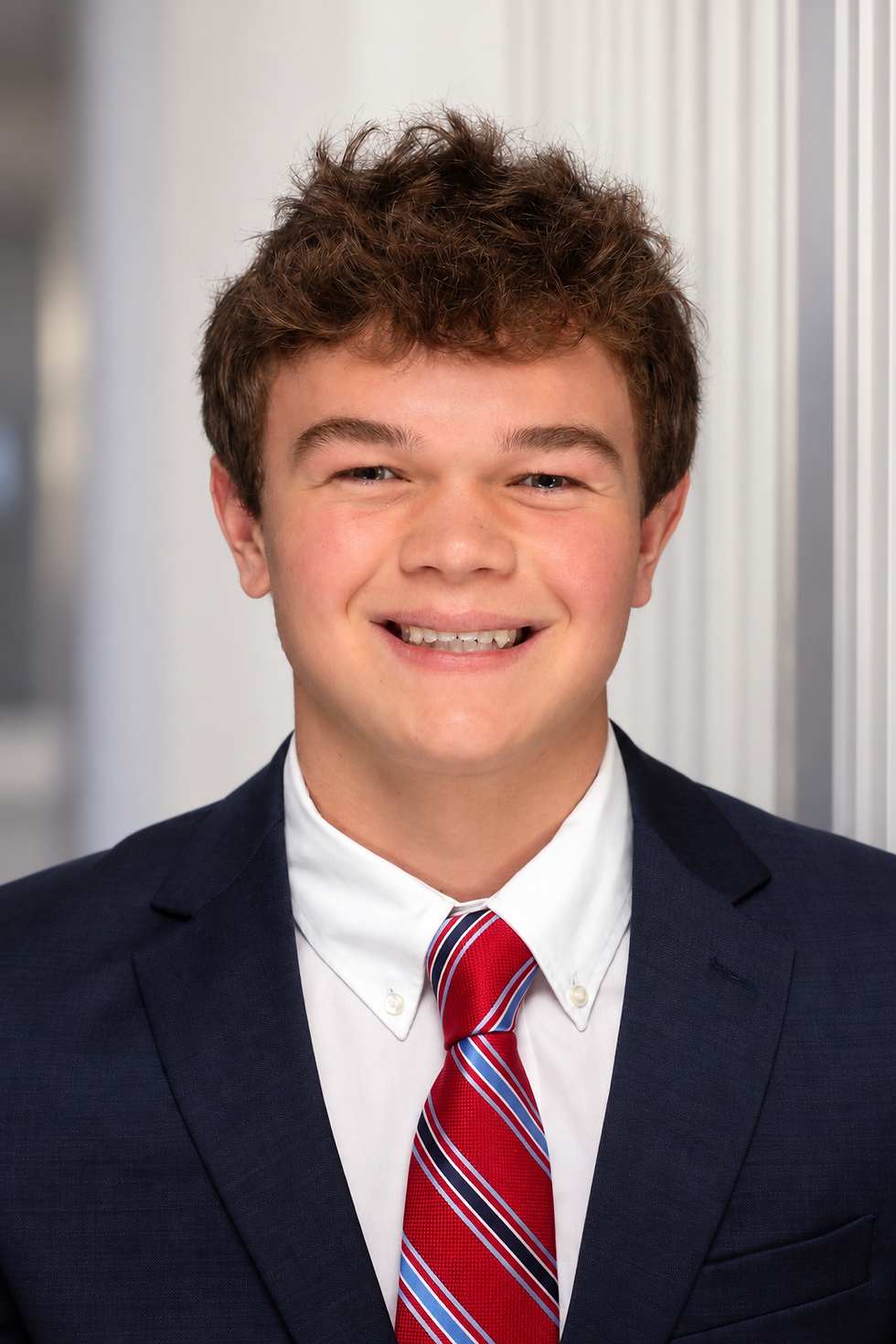 Polished Young Man in Navy Suit.png