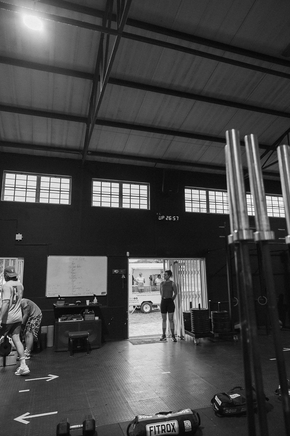 Industrial-style fitness centre and gym with weights.