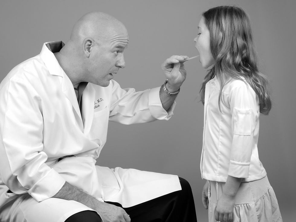 Physician Examining Young Girl's Throat_edited.jpg