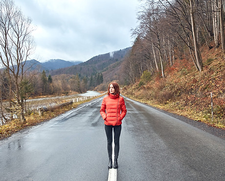 Girl Standing in Mountain Highway
