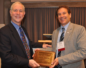 Photo of Brad receiving the Forrester Award