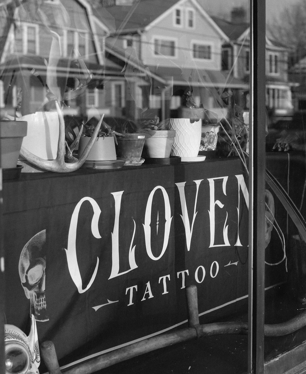 Close-up view of fresh tattoo on forearm with light healing skin