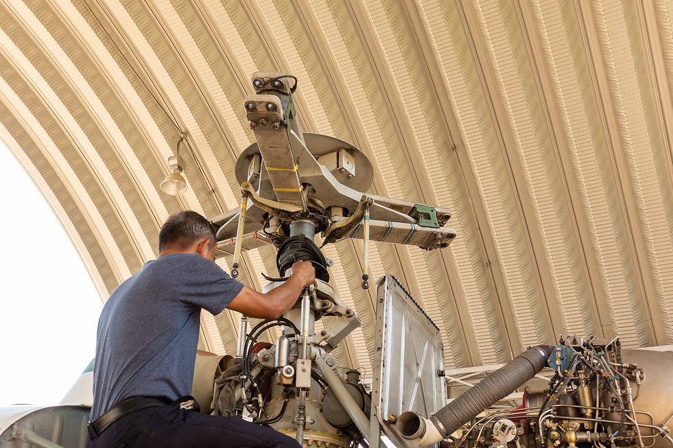 Engineer maintaining a helicopter Engine