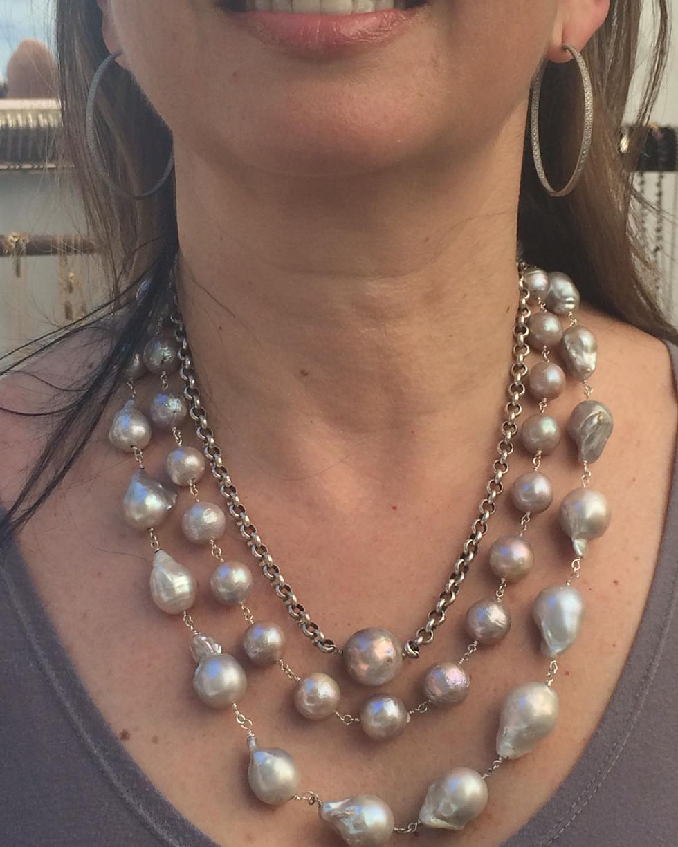 Thumbnail: Large, round, white pearl, with a heavy silver plated cable chain