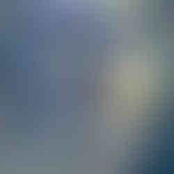 A colourful and vibrant street art mural of a woman's face on a brick wall in the trendy Kalamaja district of Tallinn, Estonia.