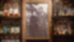 Black-and-white framed photo of Myrtle and Parker Newcomb behind the bar at Myrtle’s Sioux Falls