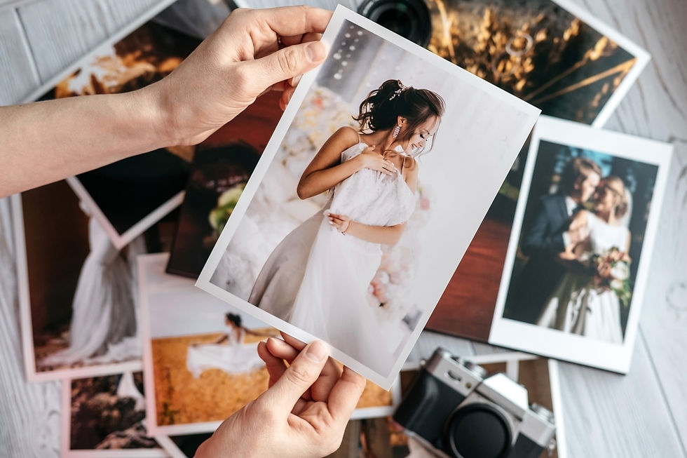 Person holding photographic prints
