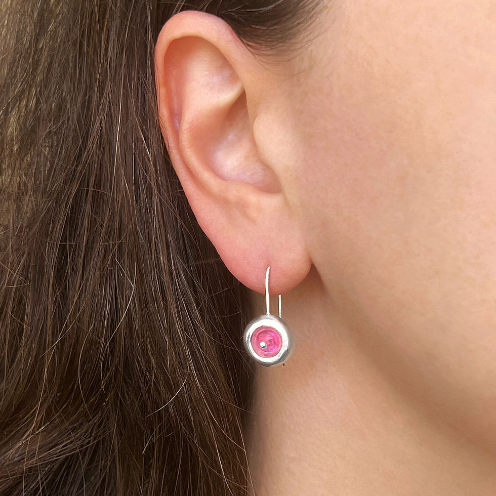 Silver earrings "Sensual collection" with pink tourmalines in ear.