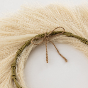 Back of white faux pampas wreath