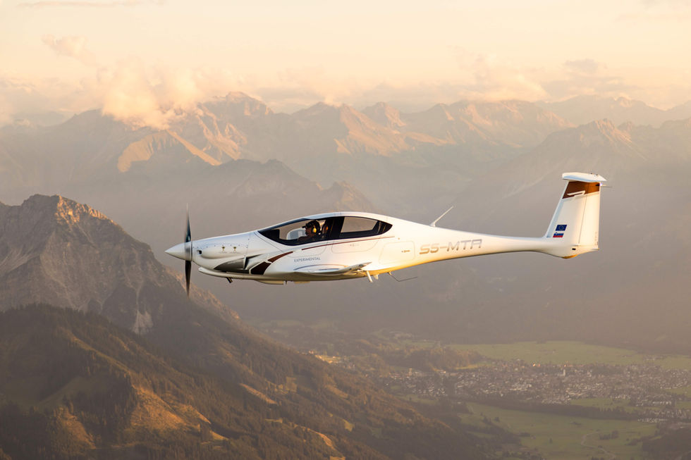Pipistrel Panthera aircraft side view above mountains during sunset, air to air photo by Samy Kramer
