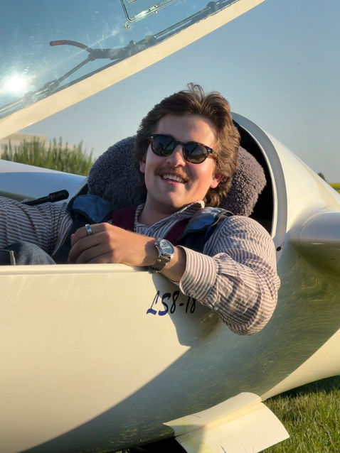 Samy Kramer sitting inside the cockpit of an LS8 glider aircraft