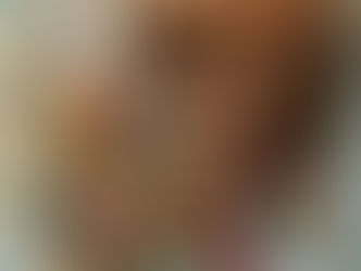 Cornucopia spilling miniature homes, cars, and goods on a world map — symbol of abundance and enough for all.