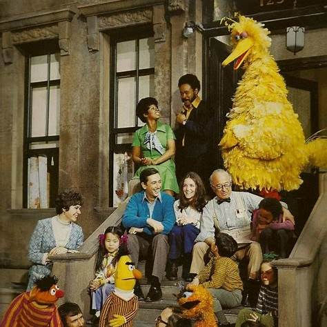 Cast of Sesame Street including Big Bird, Mr. Hooper, Gordon, and Susan on set in the 1970s.