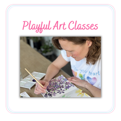 Closeup of Laura Wootton painting watercolor flowers