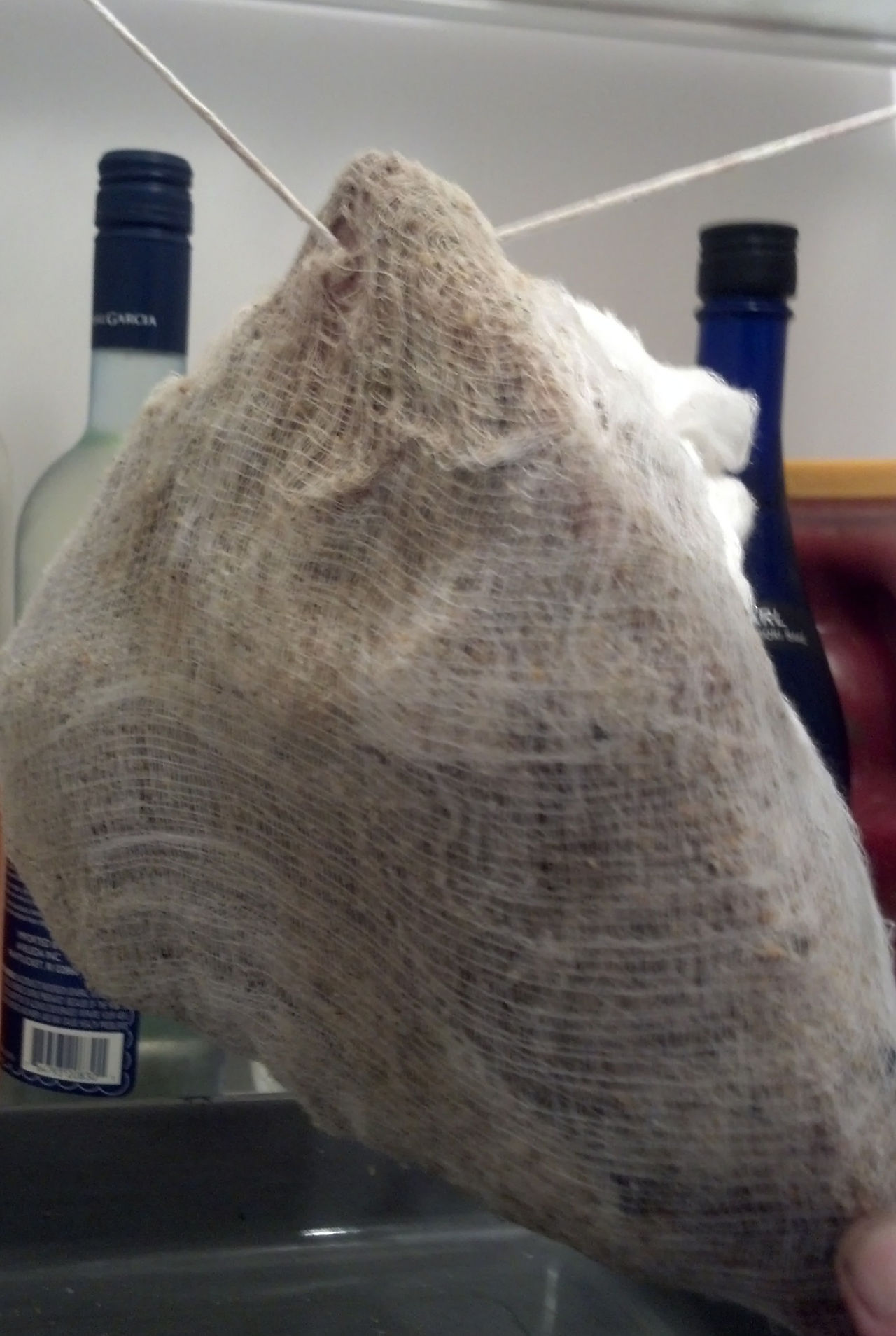 Jowl wrapped and hanging to dry.