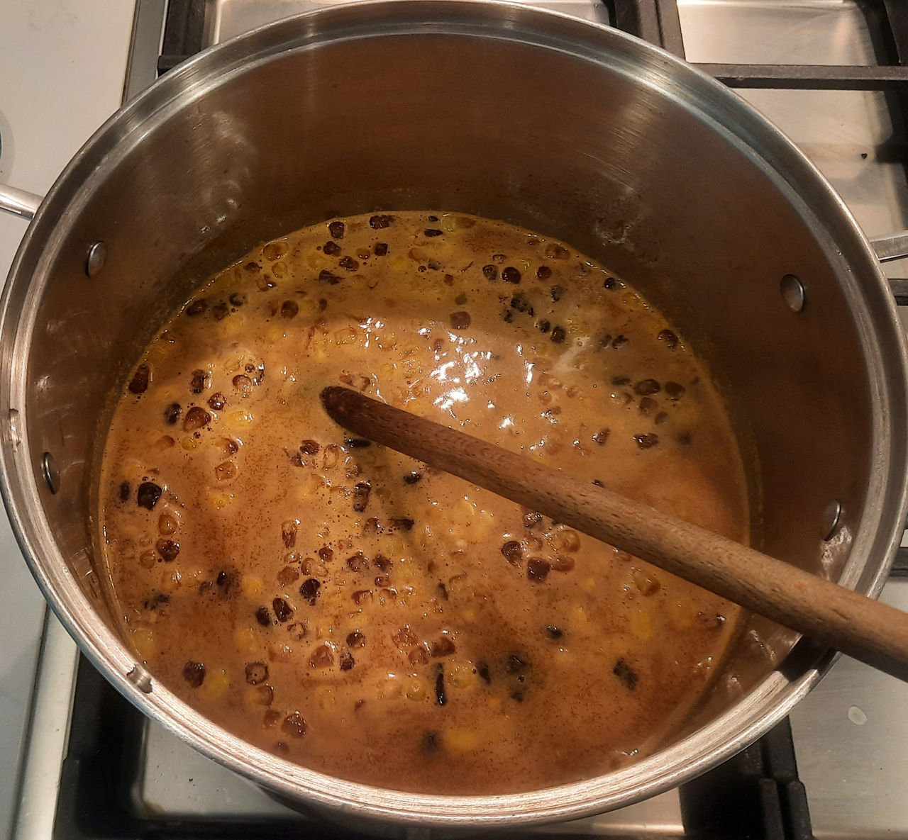 soft cheeses added to the simmering brothh and other add-ins